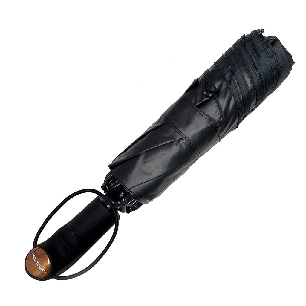 Top-view-of-a-black-Hailstorm-umbrella-that’s-strapped