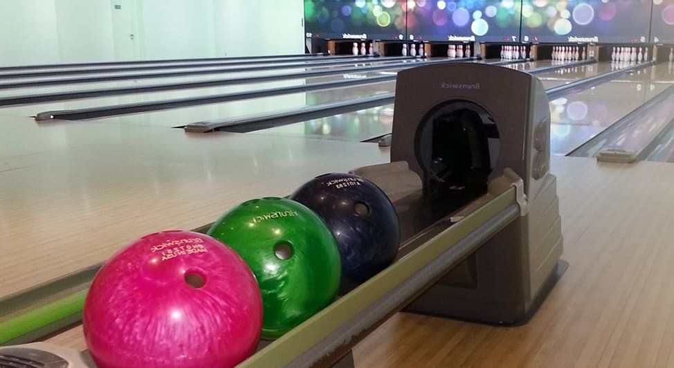 bowling alley and balls in planet bowl singapore