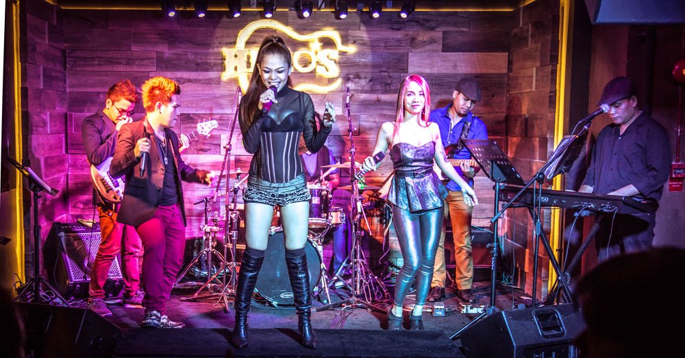 a group of women performing at hero's bar in singapore