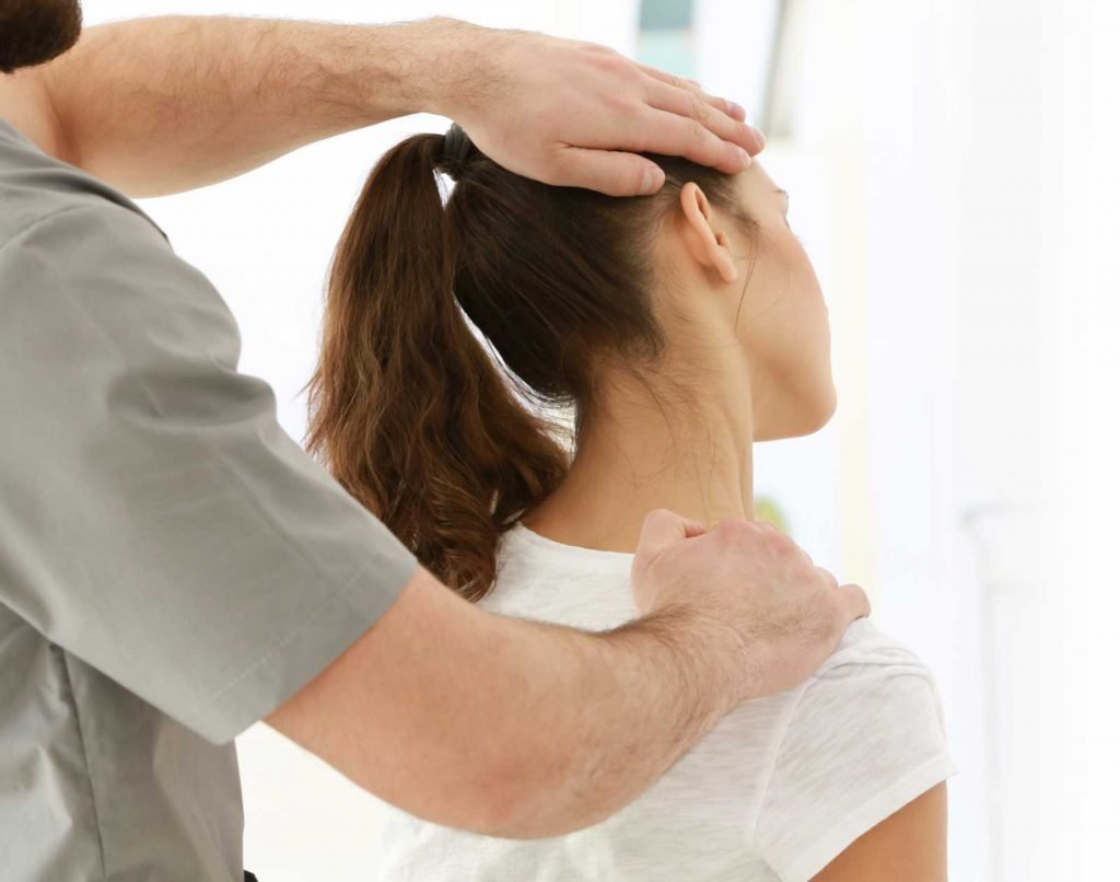 chiropractor performing neck alighnment in natural healing clinic singapore