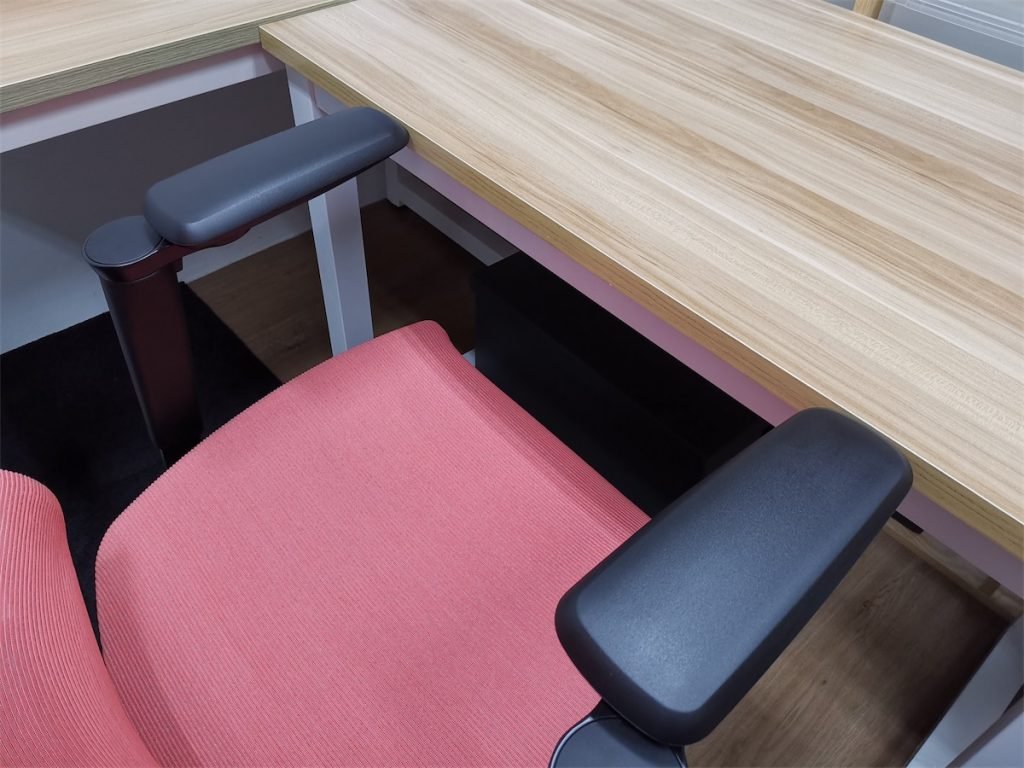 The ErgoTune chair flushed against a desk